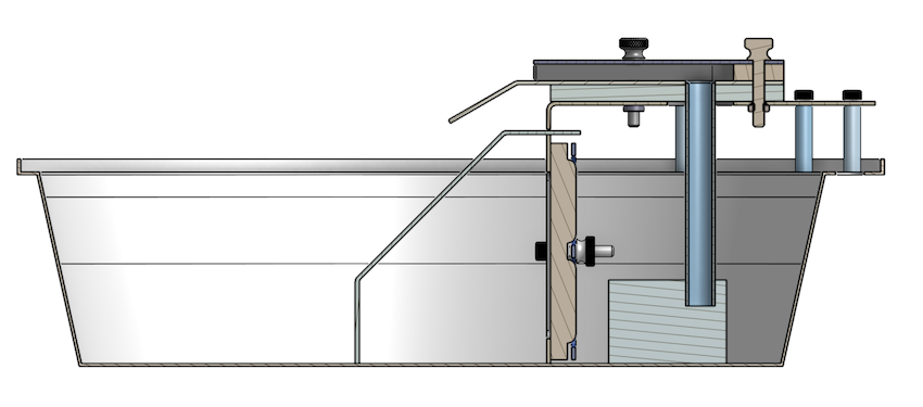 Cross-section CAD view through the bowl, showing the pump at the bottom feeding the vertical riser tube up to the spillway.